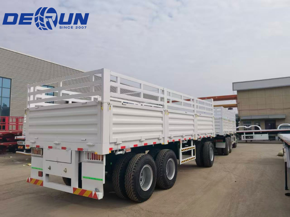 Two trucks and a semi-trailer are about to be shipped to Djibouti.
