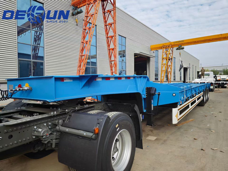 Two three-axle low-bed semi-trailers will be shipped to West Africa.
